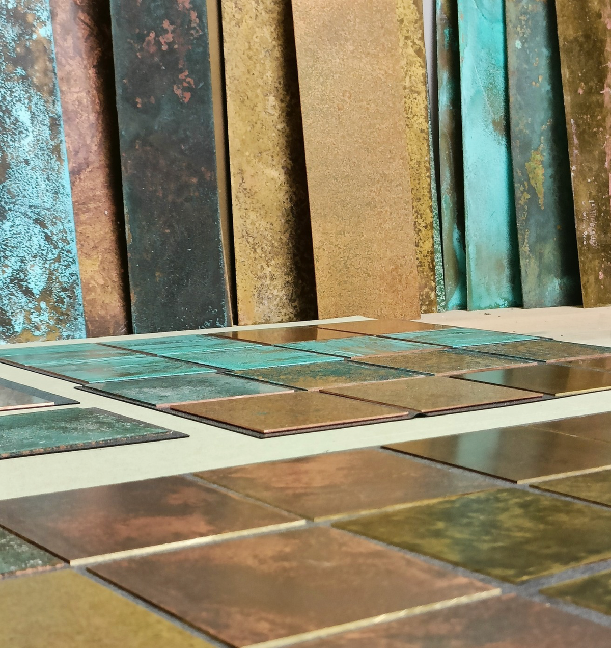 Patinated brass and copper panels and tiles in the Metal Clad workshop