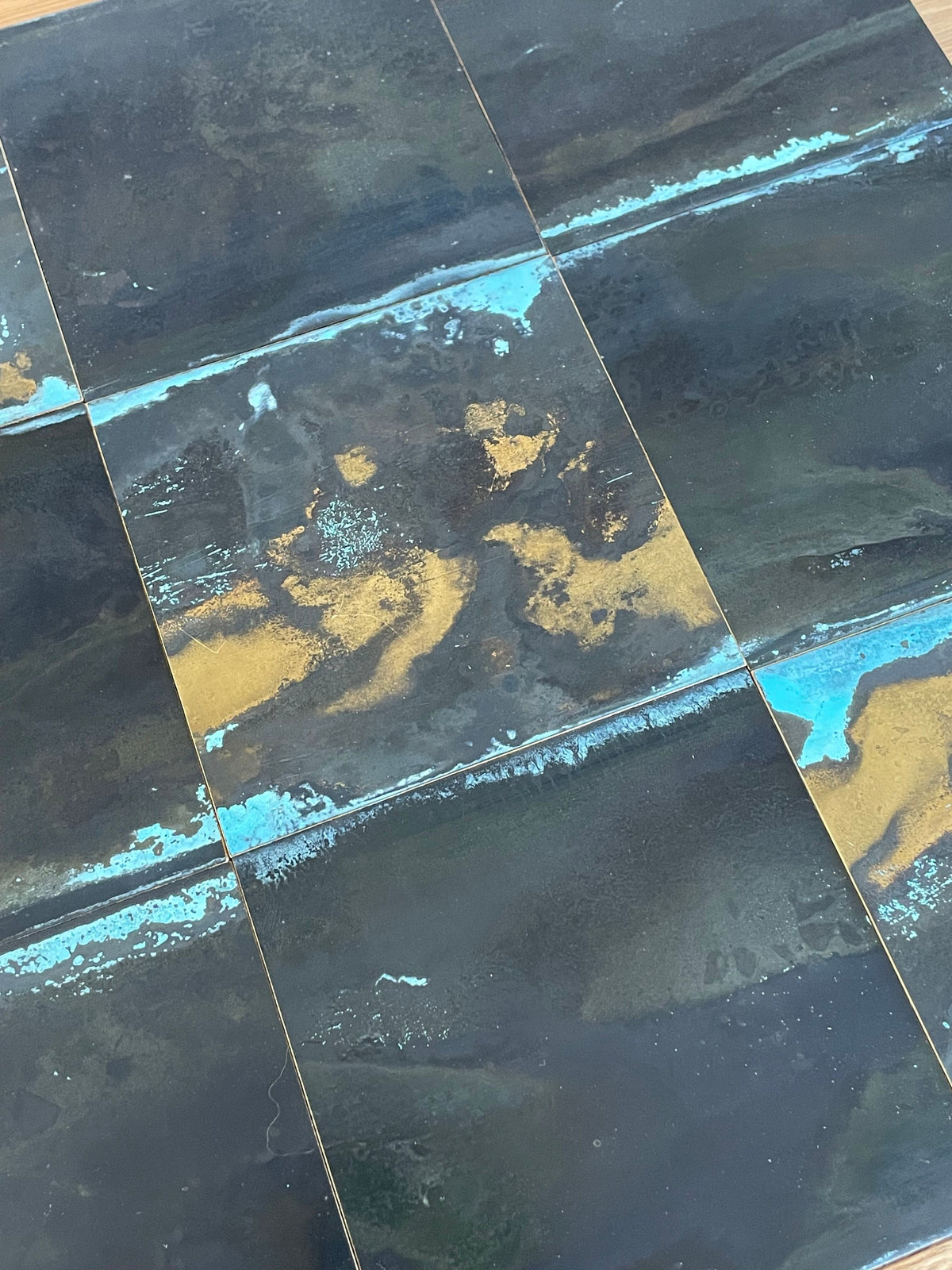 Inky Brass with Blue Bloom patinated brass by Metal Clad