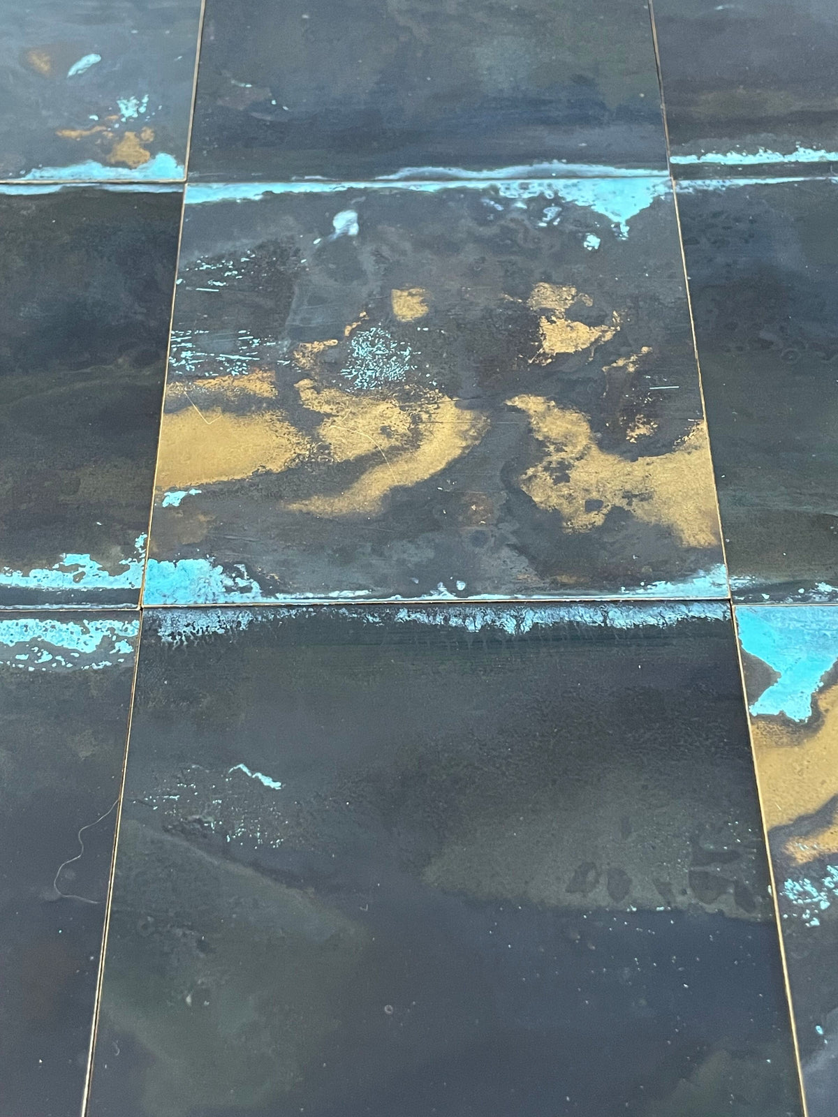Inky Brass with Blue Bloom patinated brass by Metal Clad